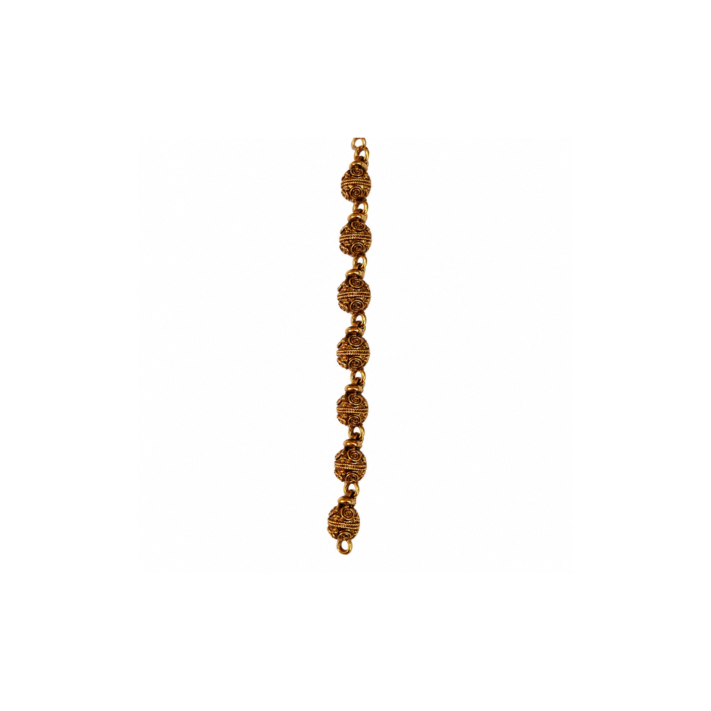 Close view of repeated embossed round beads on the antique gold-tone chain