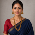 Front-facing model detail wearing the long Lakshmi-style coin necklace and both matching peacock earrings