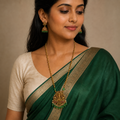 Close worn view of Lakshmi long necklace set with emerald green saree