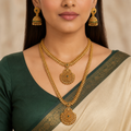 Close model view wearing the layered peacock pendant necklaces and matching green jhumka earrings